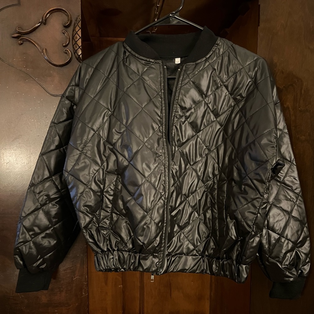 Quilted black bomber jacket with black zipper